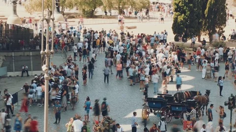 Time-lapse of crowds of people walking along the square near the Colosseum Video stock 80345951