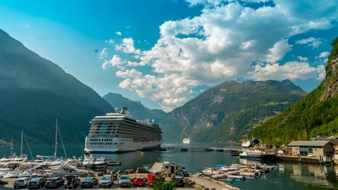 Time lapse of a cruise ship docked on a sunny blue sky day on a lake Stock Footage 114769335