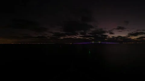 Time lapse of a cruise ship at sunset, sailing under a bridge in Tampa Stock Footage 264940404