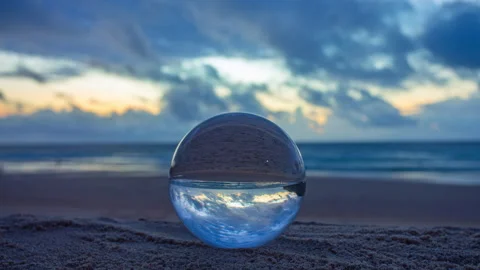 Time lapse Crystal Ball Reflection of a beautiful Beach Sunset Stock Footage 337980396