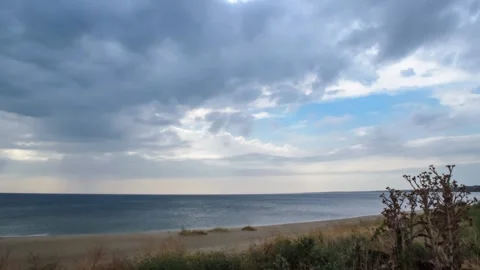 Time lapse of cumulonimbus clouds over the sea coast Stock Footage 137428041