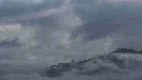 Time lapse of a cumulus cloud over a mountain in the jungle. Concept of cli.. Stock Footage 249625690