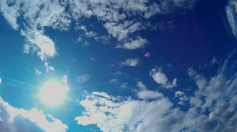 Time lapse of cumulus clouds rolling in the afternoon through bright blue sky. Stock Footage 54720820