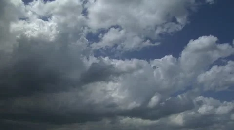 Time-lapse Cumulus Nimbus clouds build into dark ominous sky then fade Stock Footage 10869639
