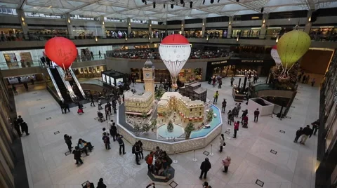 Time Lapse of customers walking around Christmas decorations at a shopping mall Stock Footage 45135651