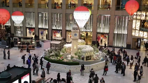 Time Lapse of customers walking around Christmas decorations at a shopping mall Stock Footage 45407137