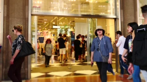 Time lapse of customers walking out of store Stock Footage 76870071
