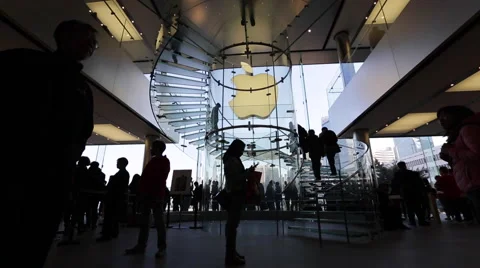 Time Lapse of customers walking on the spiral stairs at an Apple store Stock Footage 45407647