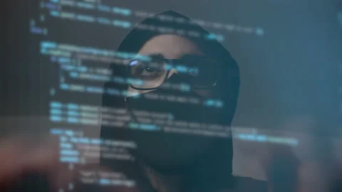 Time lapse of a cyber hacker with binary code on the screen 動画素材 148555030