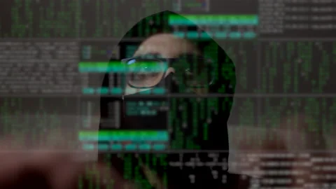 Time-lapse of a cyber hacker with binary code on the screen. Man face Stock Footage 148555346