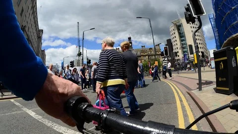 Time lapse cyclist riding through city suare leeds uk Stock Footage 111321114