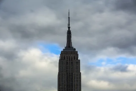 Time-lapse of dark clouds moving over the Empire State Building in New York Stock Footage 105413411