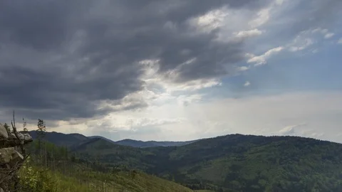 Time lapse of dark clouds over the mountains. Stock Footage 111828131