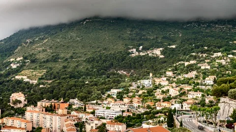 Time-lapse of dark clouds over Monaco hills Stock Footage 129382449