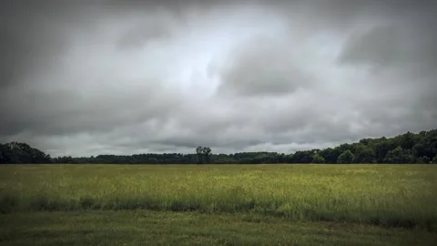 Time lapse of dark clouds over a field just before a big storm Stock-Footage 132217849