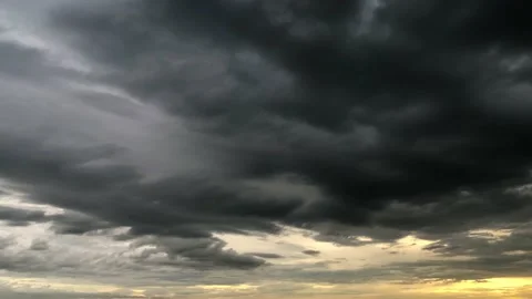 Time lapse Dark clouds before the rain, Storm clouds moving on golden sky Stock Footage 232287889