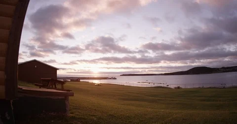 Time-lapse of dark clouds rolling over the lake at sunset 스톡 동영상 109561598