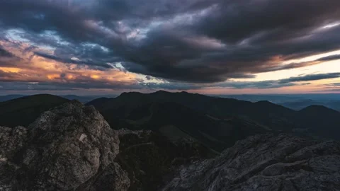 Time lapse Dark dramatic clouds sky in evening alps mountains nature at sunset Stock Footage 220073375
