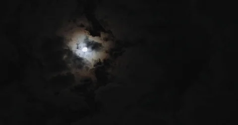 Time-lapse, dark night dramatic sky with moon light and moving clouds Stock Footage