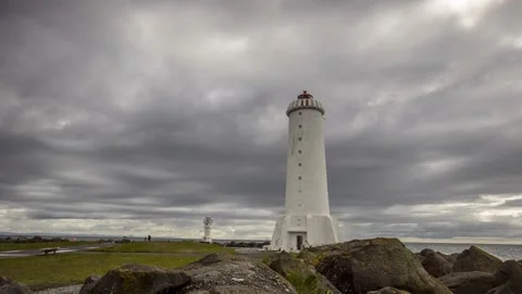 Time Lapse of dark rain clouds gathering over the old Akranes Lighthouse Stock Footage 155774326
