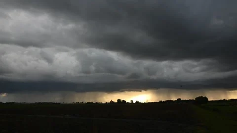 Time lapse of a dark sky of a thunderstorm at sunset Stock Footage 284362099