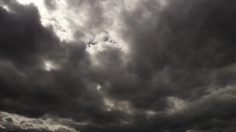 Time-lapse dark storm clouds roll toward the camera Stock Footage