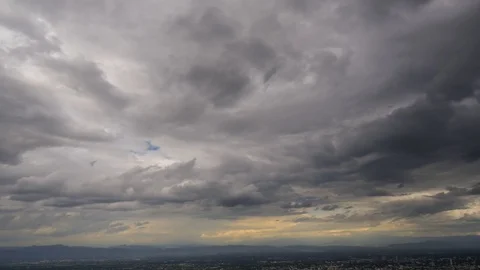 Time lapse of Dark storm clouds over town. Stock Footage 111069315