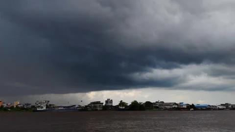 Time lapse Dark storm clouds gather over the Kapuas riverside scenery Stock Footage 305526788