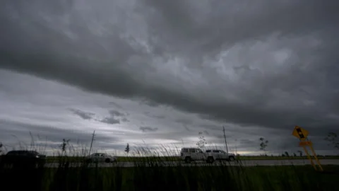 Time lapse of dark storm clouds rapidly moving across the sky before a Stock Footage 340382612