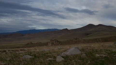 Time lapse of dark sunset clouds above foothills and Sierra Nevada Mountains Stock Footage 119398868