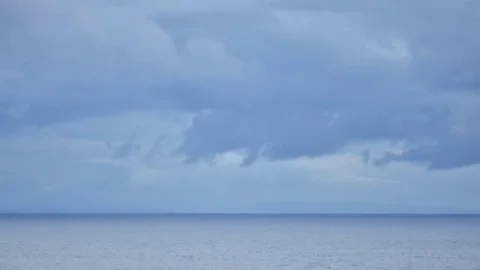 Time lapse darkening storm clouds over ocean in Oahu Stock Footage