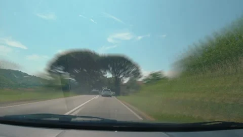 Time lapse of dashboard camera view of car driving on countryside road Stock Footage 156077653