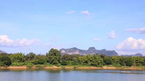 Time lapse day of blue sky and white cloud over the Mekong River Stock Footage 143956231