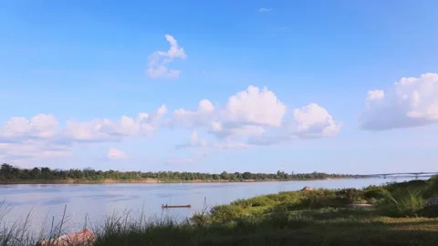 Time lapse day of blue sky and white cloud over the Mekong River Stock Footage 143956259