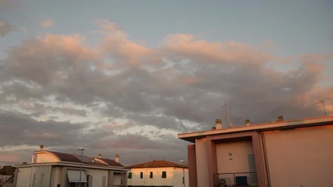 Time lapse day to night of clouds on downtown's houses, before the storm Stock Footage 129271387