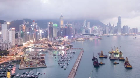 Time Lapse of Day to Night Hong Kong Harbor and Skyline Stock Footage 54112331