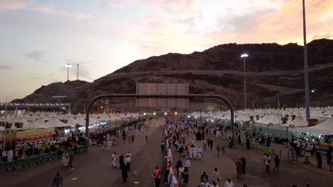 Time lapse day to night: Pilgrims in the Mina area, walking to Jamarat. Stock Footage 139040734