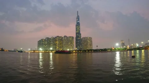 Time lapse day to night riverside skyscraper Stock Footage 158428839