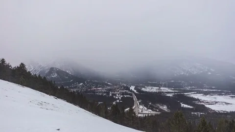 Time lapse day to night winter ski town on a foggy evening Video stock 72693363