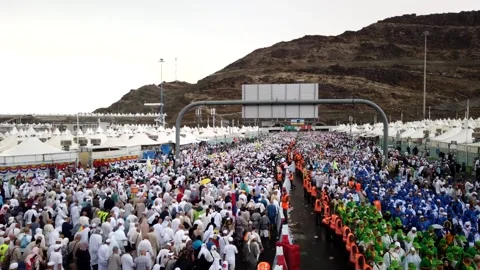 Time lapse from day to rainy : Pilgrims in the Mina area, walking to Jamarat. Stock Footage 139249084