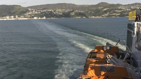 Time-lapse from the deck of a ship turning to leave Wellington Harbour. Stock Footage 136998155