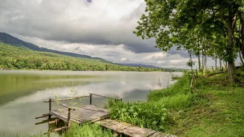 Time lapse of dense clouds moving  above mountain ranges at Huay Tung Tao Stock Footage 198778172