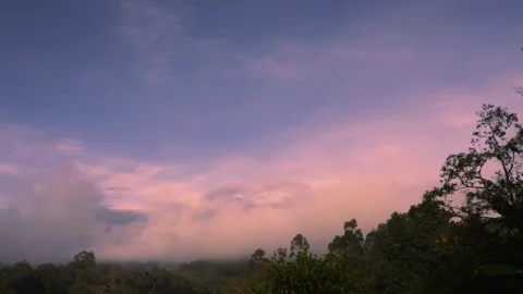 Time-lapse of the dense fog of the dawn rising up over the eastern Andean mou Stock Footage 305771859