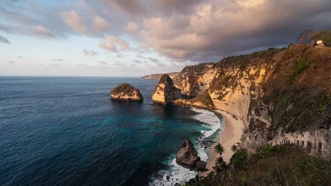 Time lapse of Diamond beach in a beautiful morning sunrise, Nusa Penida island Stock Footage 129358126