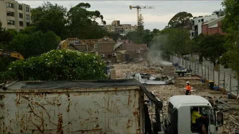 Time lapse a digger and rubble on cleared housing in Sydney 4K Stock Footage 325753997