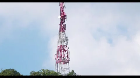 Time lapse Directional antenna array on a red and white communication tower.. Stock Footage 295386824