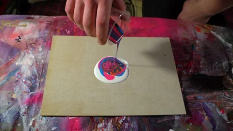 Time lapse of dirty cup fluid art pouring bright colored acrylic paints Stock Footage 154699474