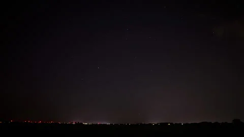 Time lapse of a distant highway at night with stars in the sky Stock Footage 282340661