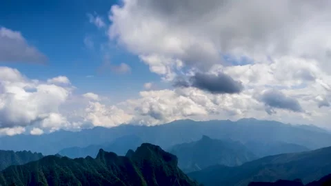 Time Lapse of Distant Mountain Valley Layer Peak Forest Flow Cloud Stock Footage 337942390