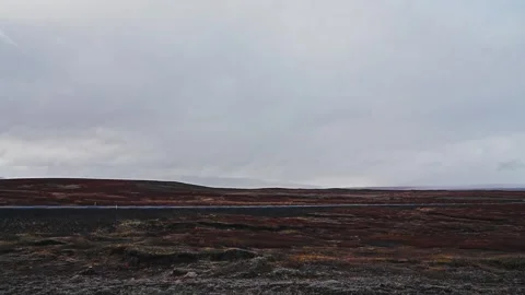 Time-lapse of a distant road under a dramatic cloudy sky. 스톡 동영상 255117971